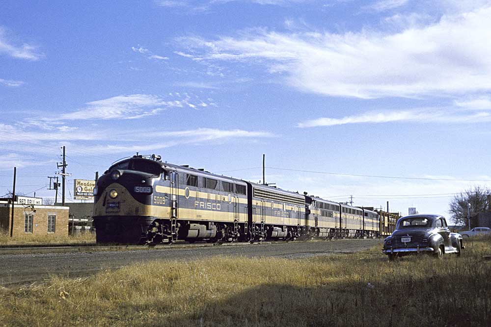 Black and yellow diesel locomotives on freight train