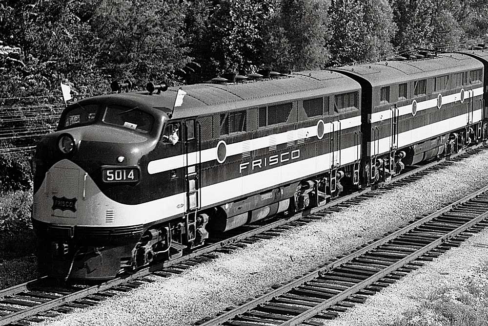 Streamlined diesel locomotive displaying white flags on cab