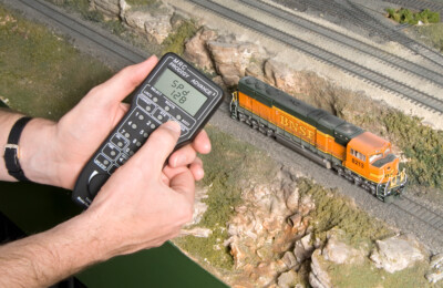How do I check the DCC momentum settings on my locomotive?