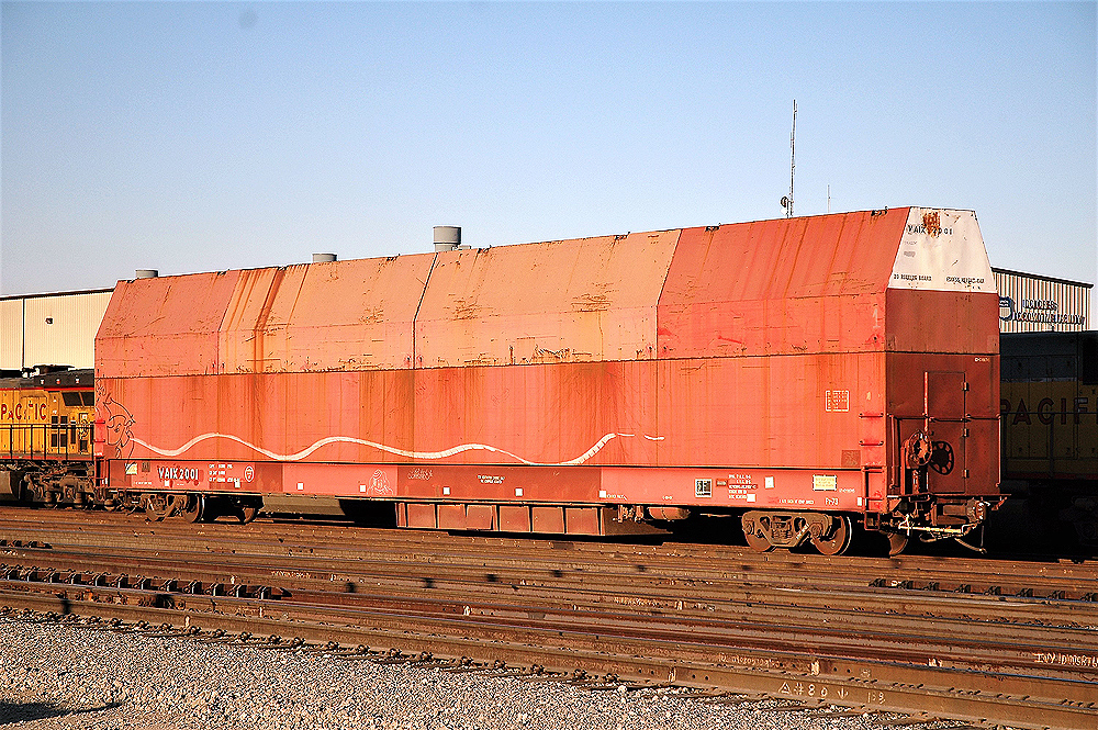 Specialized flat car made to carry an airplane wing.