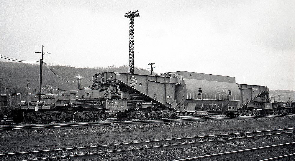 An extreme-duty train car used to carry electrical generating equipment.