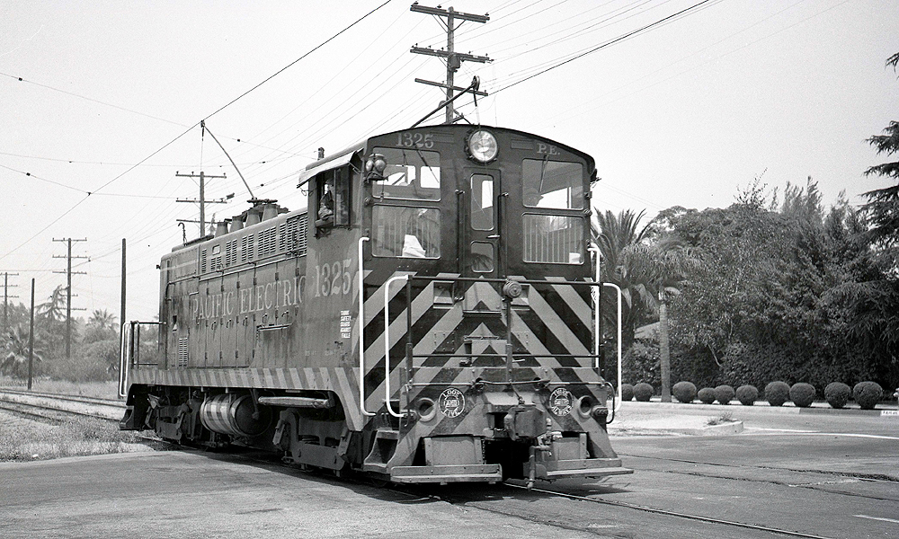 Baldwin diesel locomotive with trolley pole extended.
