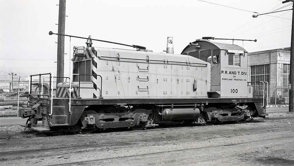 EMD locomotive with two trolley poles.