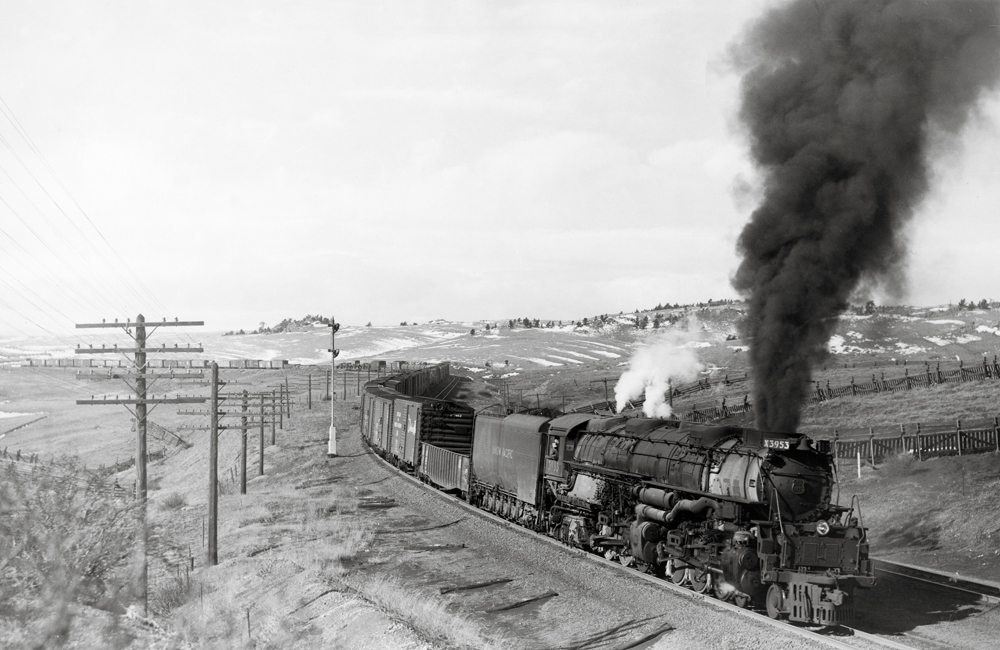 Steam locomotive with freight train on curve