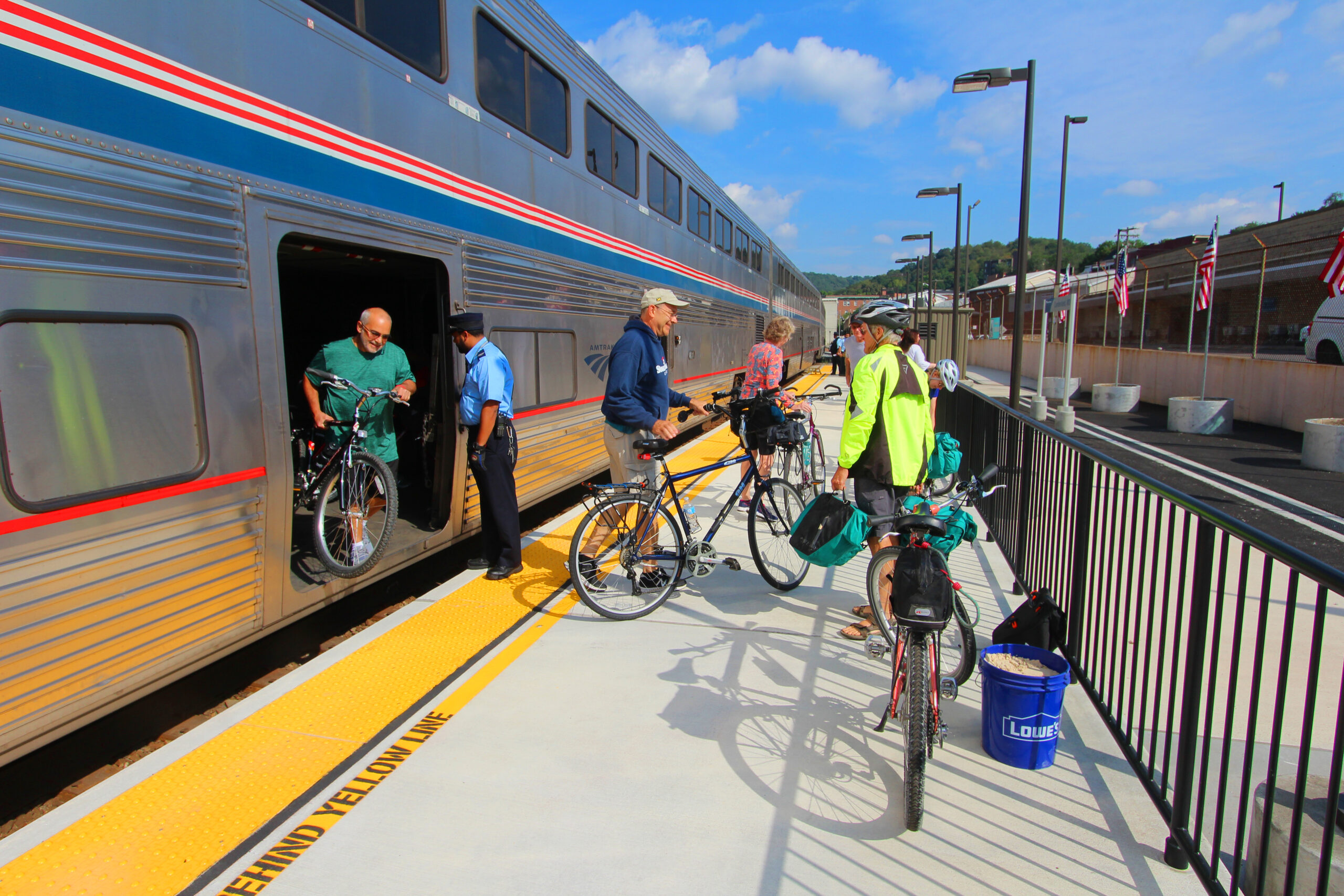 Passengers remove bicycles from Amtrak train