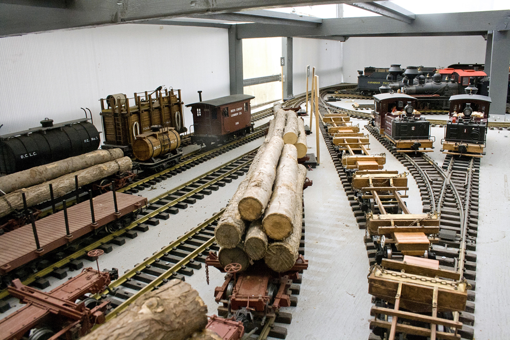 Model rail yard in a greenhouse