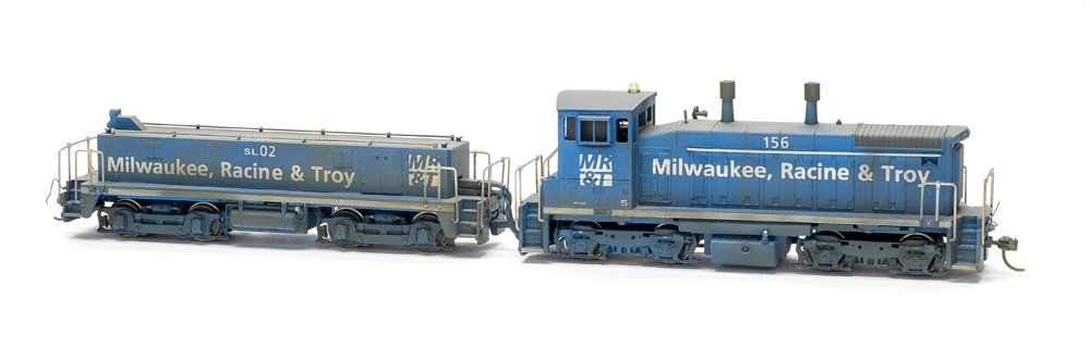End-cab switcher and slug set painted blue with white graphics.