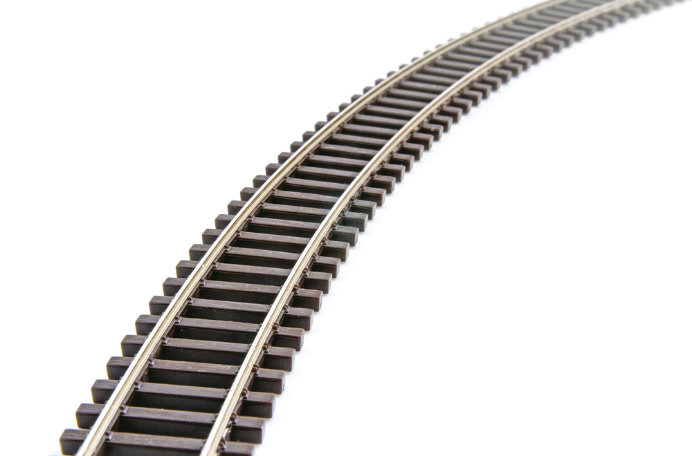 Photo of model train track on white background
