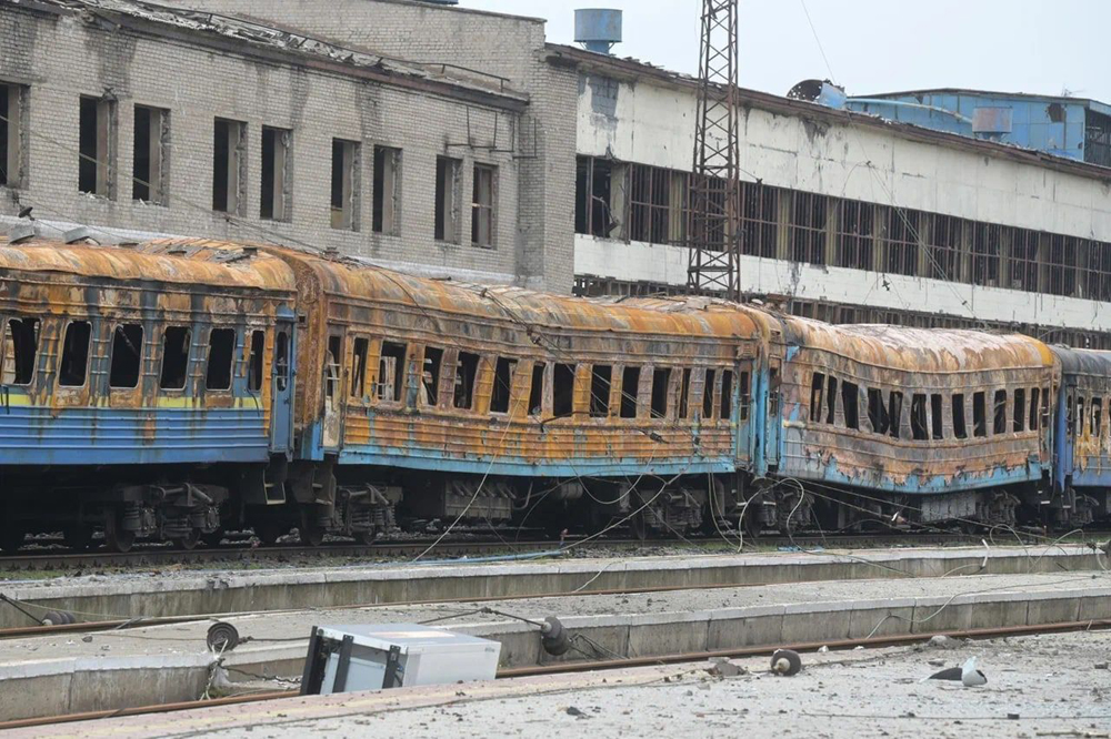 Passenger cars badly damaged by fire