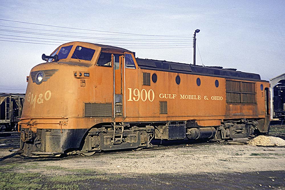 Streamlined red diesel locomotive with bulbous cab 