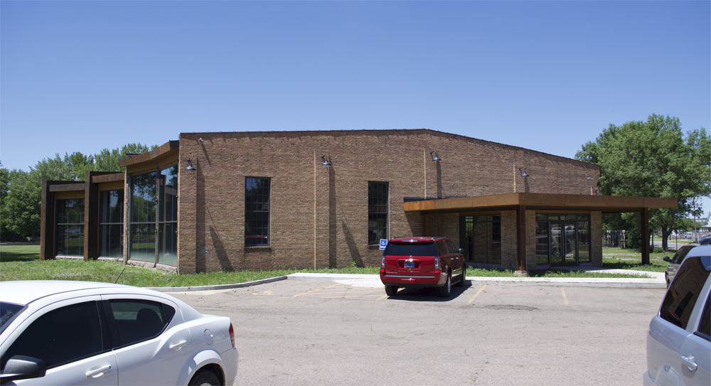 Converted roundhouse with vehicles in front