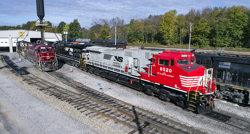 Several locomotives in a rail yard.
