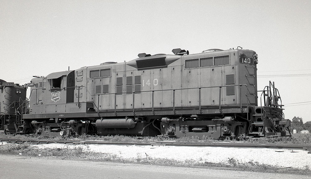 Black and white image of a locomotive on a track.