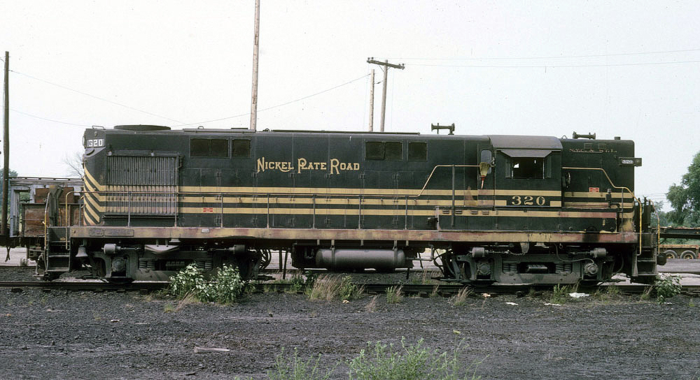 A color image of a black and yellow-striped locomotive.