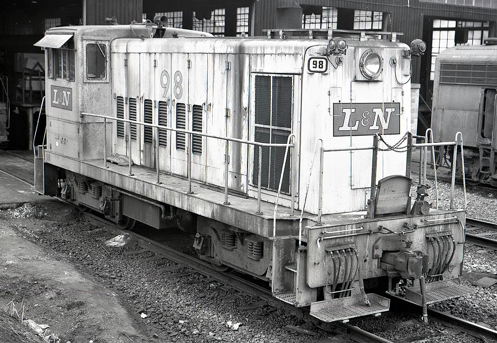 Black-and-white image of an end-cab locomotive.