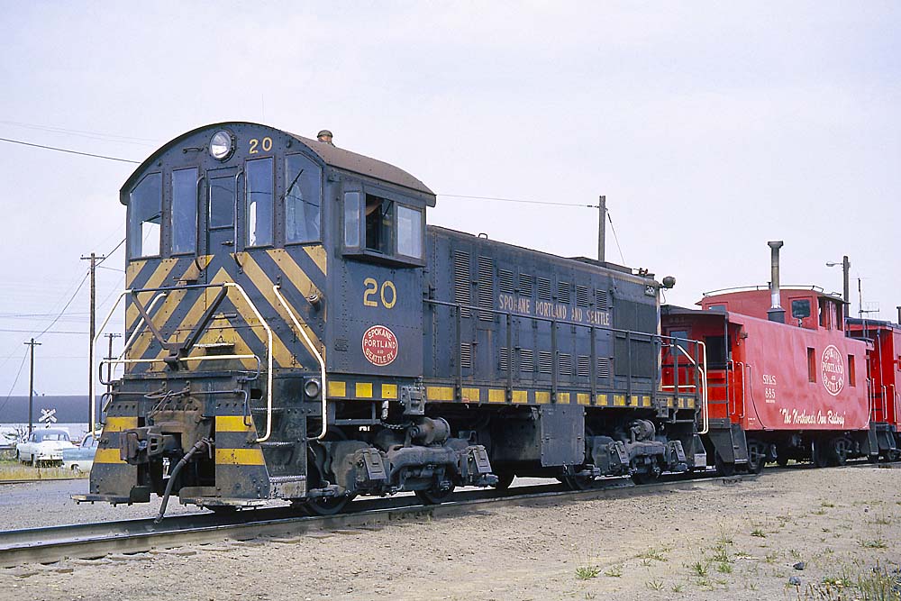 End-cab diesel locomotive with red caboose