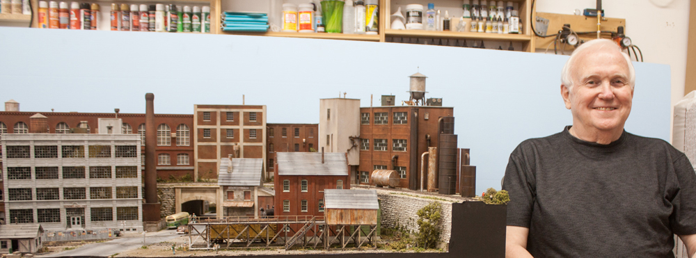 a man standing by his layout