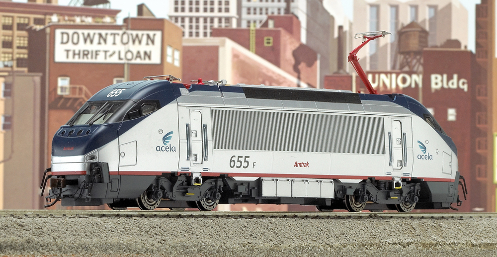 Photo of HO scale modern electric locomotive with city backdrop