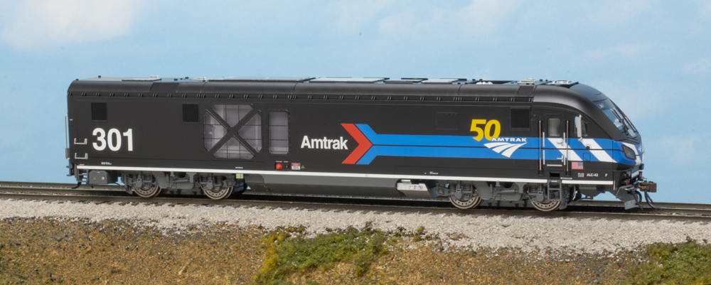 Photo of modern HO scale locomotive on scenicked base
