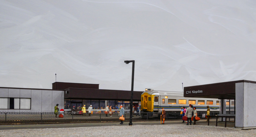 figures at a train station