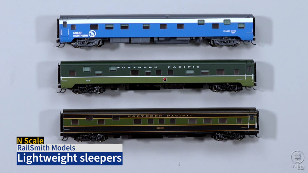 Photo of N scale passenger cars on gray background