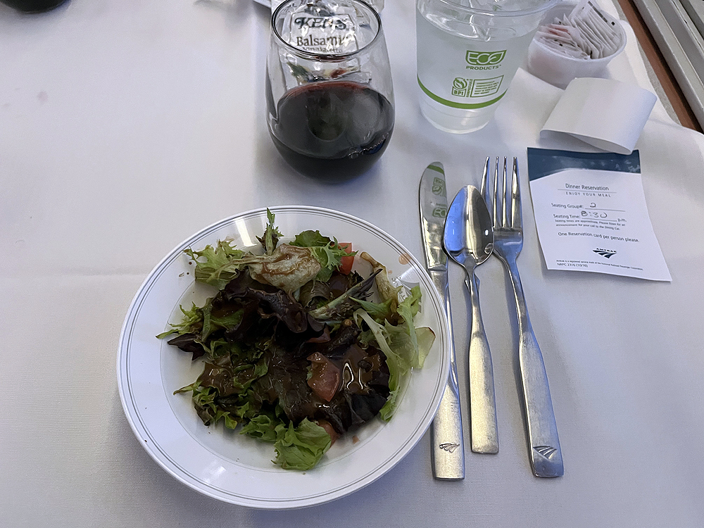 A meal on a table in a dining car.