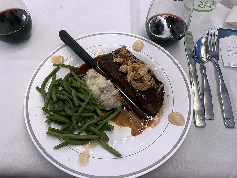 Plated steak dinner on a table.