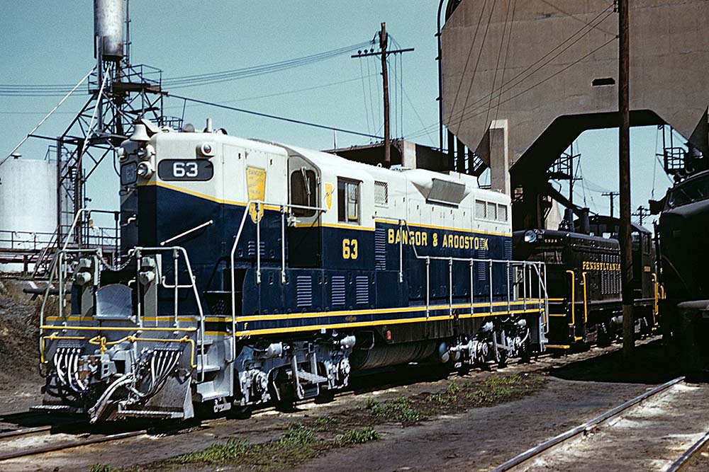 Blue and white diesel Bangor Aroostook locomotive at service area