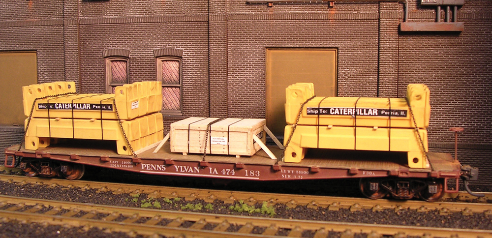 model flatcar with yellow load