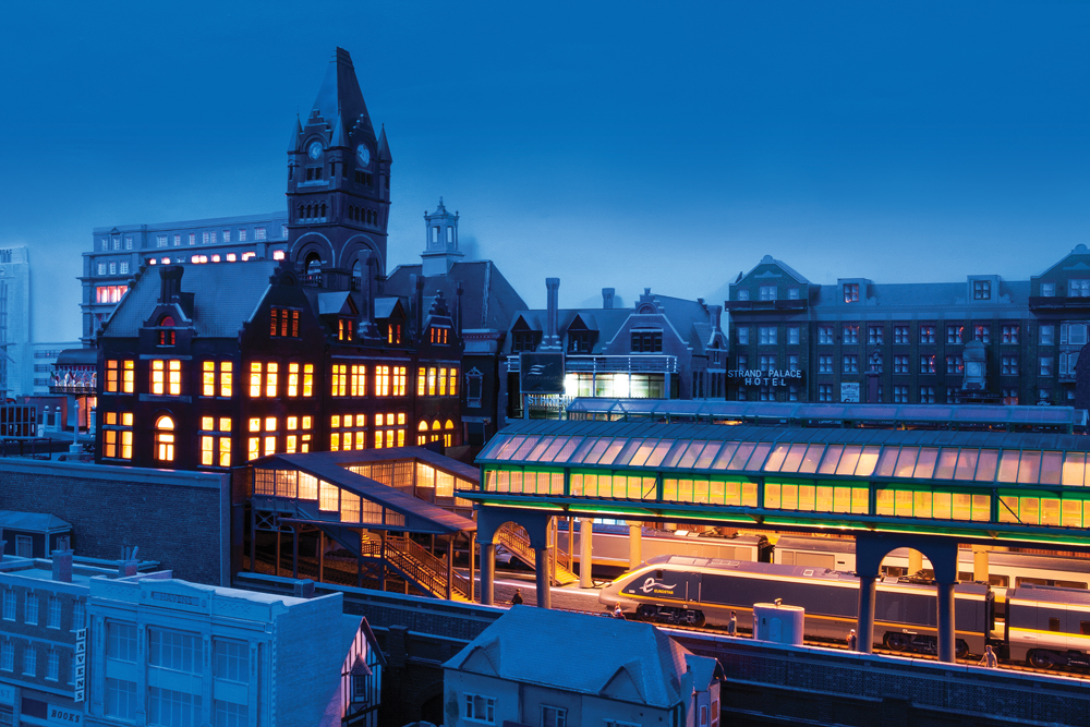 Twilight over a city with many lit windows.