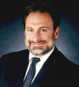 Bearded man in suit and tie