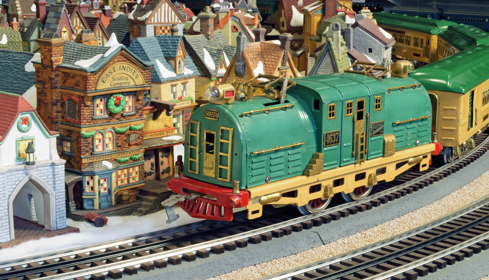 tinplate engine near holiday buildings on layout