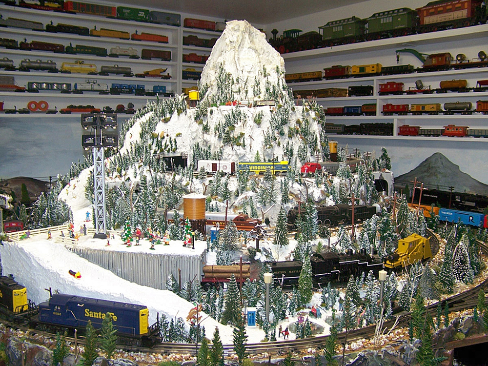 tall mountainous train layout with trees