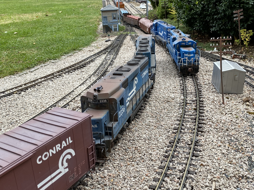 two blue diesels on a garden railway