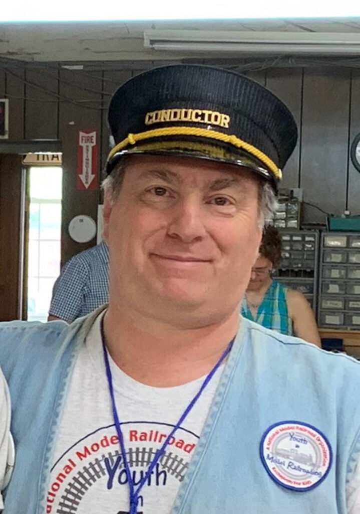 An image of a man wearing a hat.