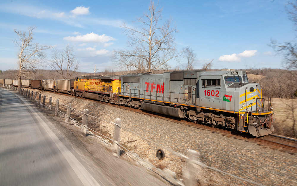 silver and yellow locomotive