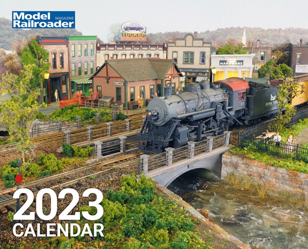 Steam locomotive train in a model railroad scene.