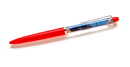 Red pen with liquid filled barrel and image of locomotive.