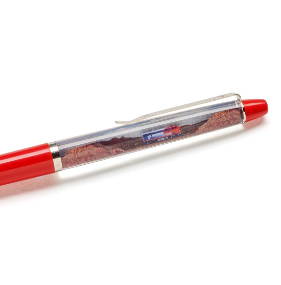 Close up image of a red pen with a Santa Fe locomotive image.
