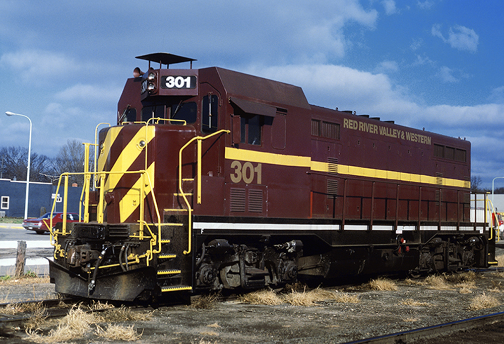 Maroon and yellow diesel switcher
