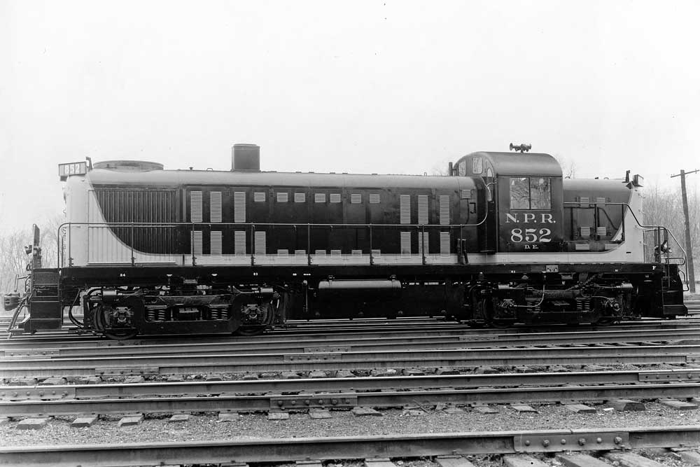 Black diesel locomotive in train yard