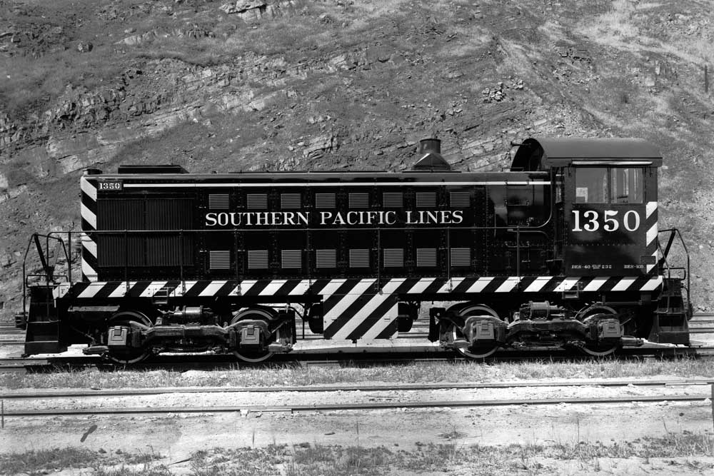 Black end-cab switching locomotive in profile