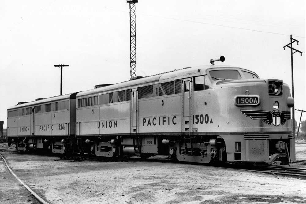 Streamlined diesel locomotive in train yard