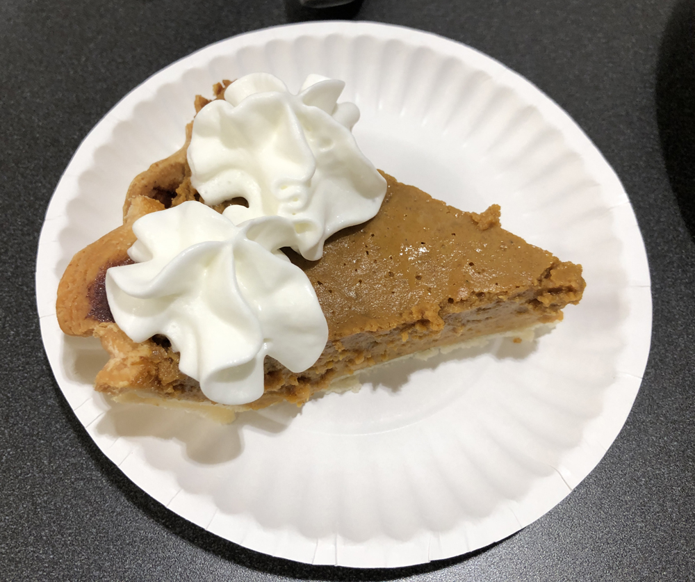 piece of pumpkin pie with whipped cream