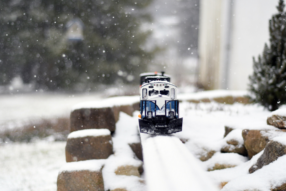 snowy scene with model locomotive and station