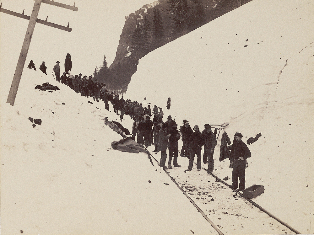 man going to shovel out a stranded train