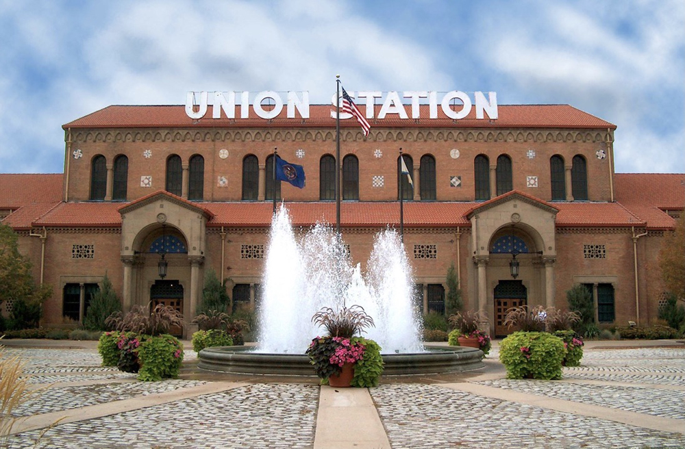 Station building with fountains in foreground
