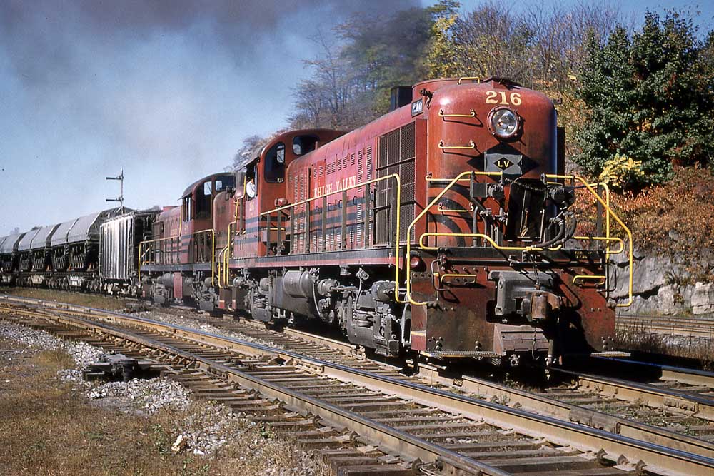Red-and-black diesel locomotives on freight train