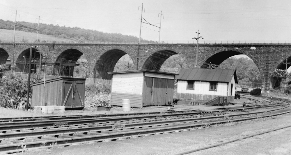 Black and white images of a stone bridge.