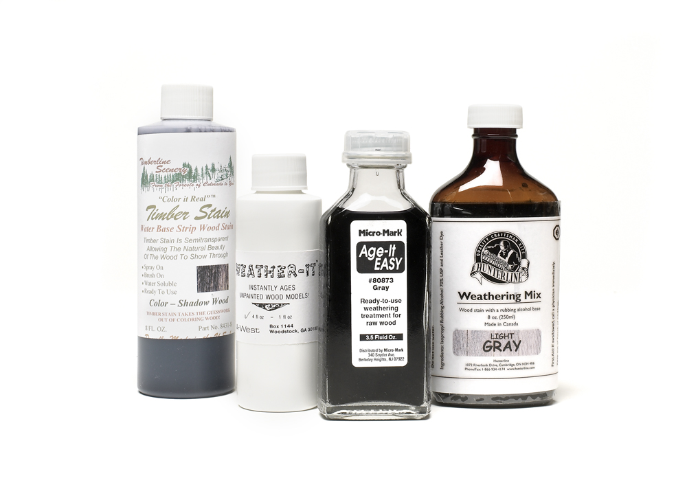 An image of bottles of wood stains for modeling.